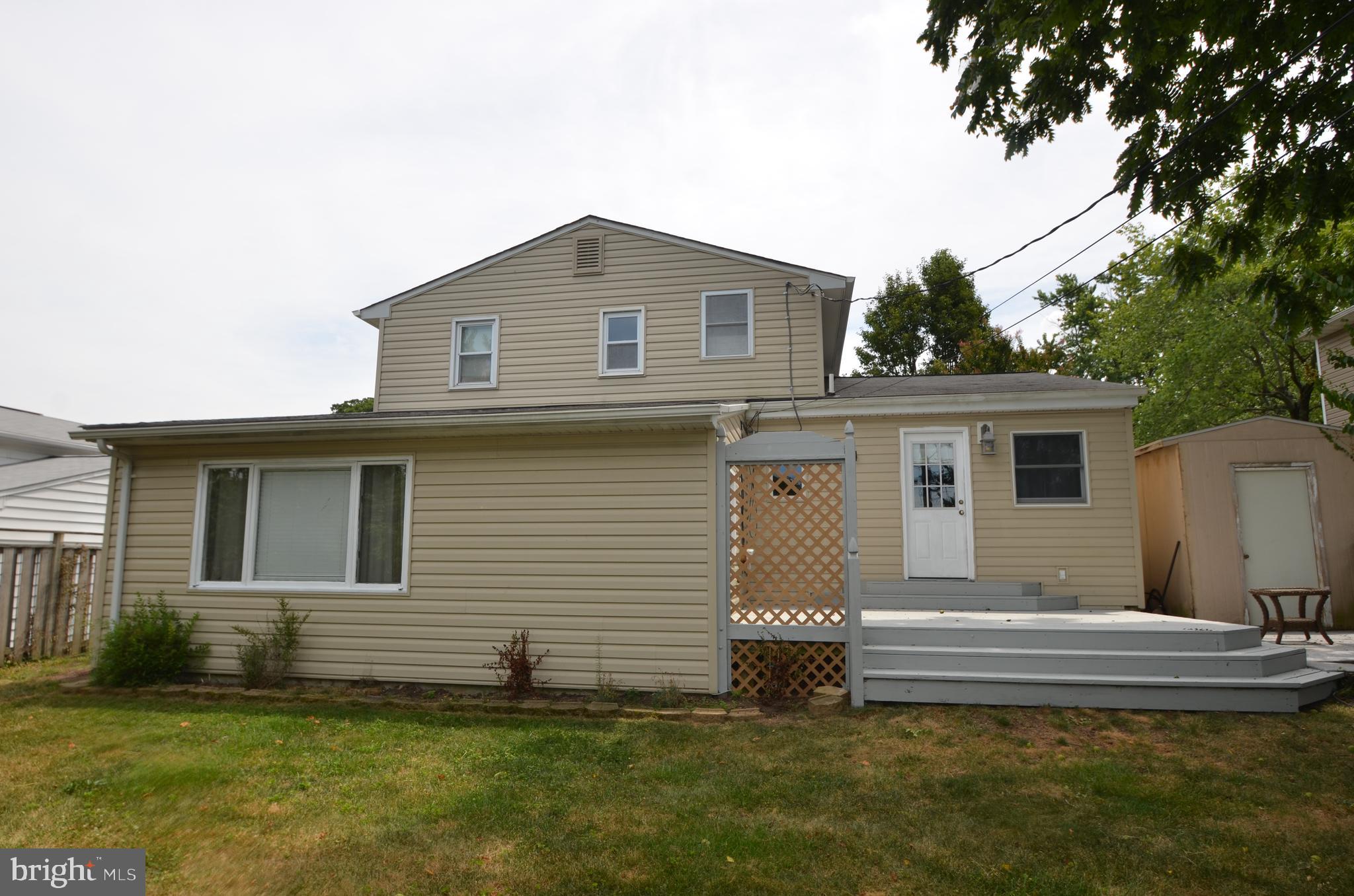 422 Madingley Road Linthicum Heights, MD 21090 - Photo 31 of 36 a front view of a house with a yard