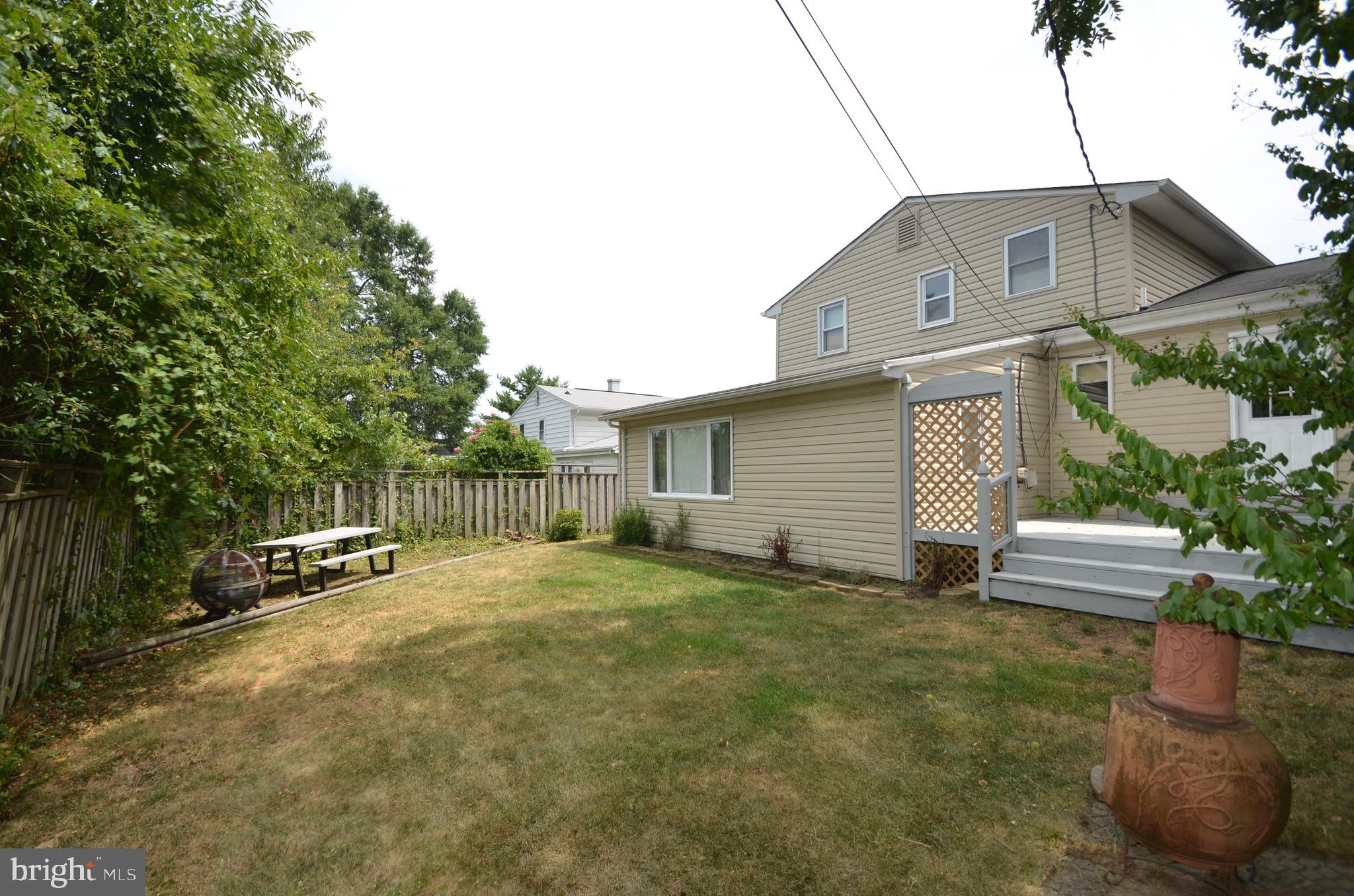 422 Madingley Road Linthicum Heights, MD 21090 - Photo 36 of 36 a backyard of a house with table and chairs