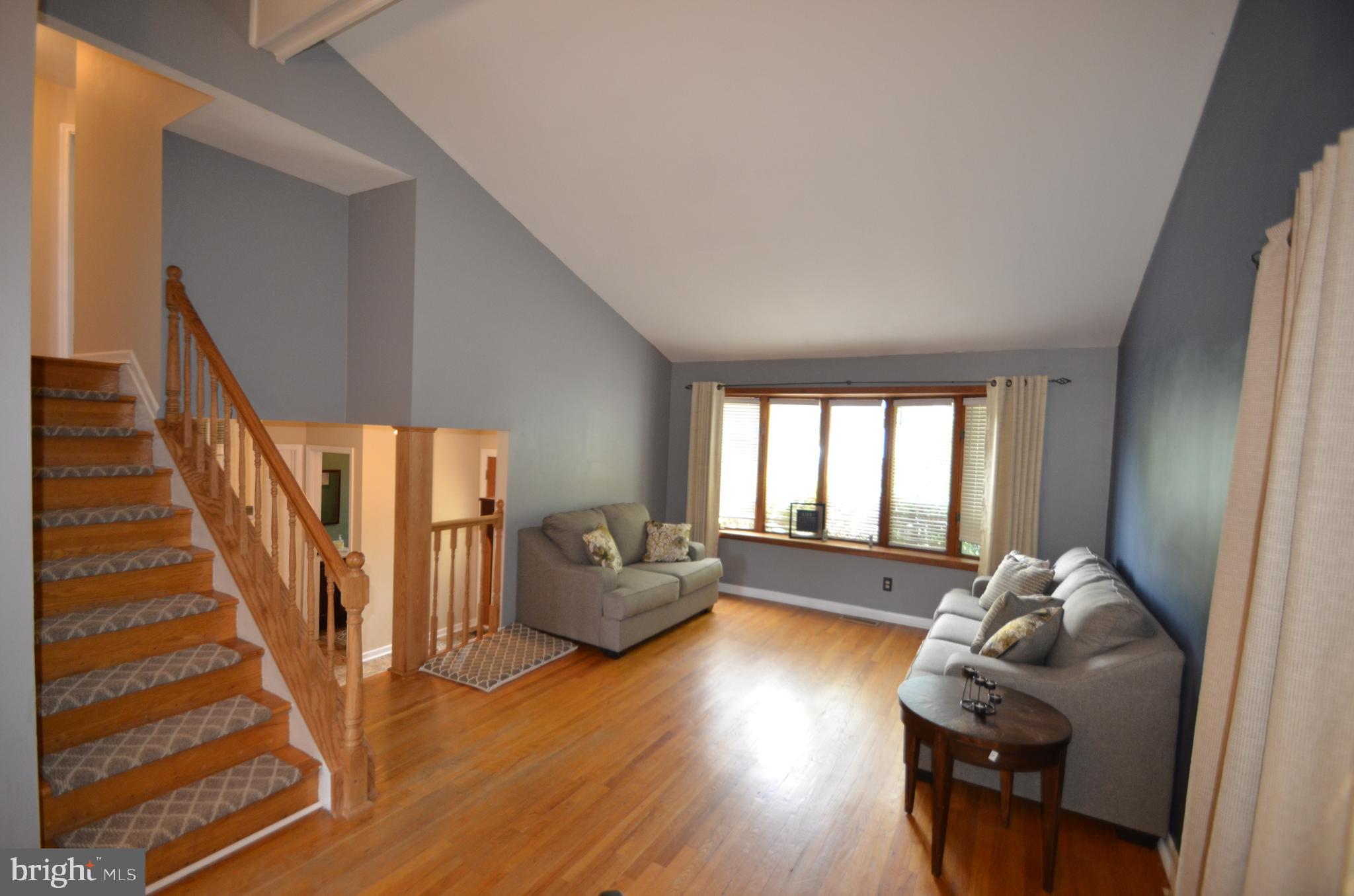 422 Madingley Road Linthicum Heights, MD 21090 - Photo 5 of 36 a living room with furniture and wooden floor