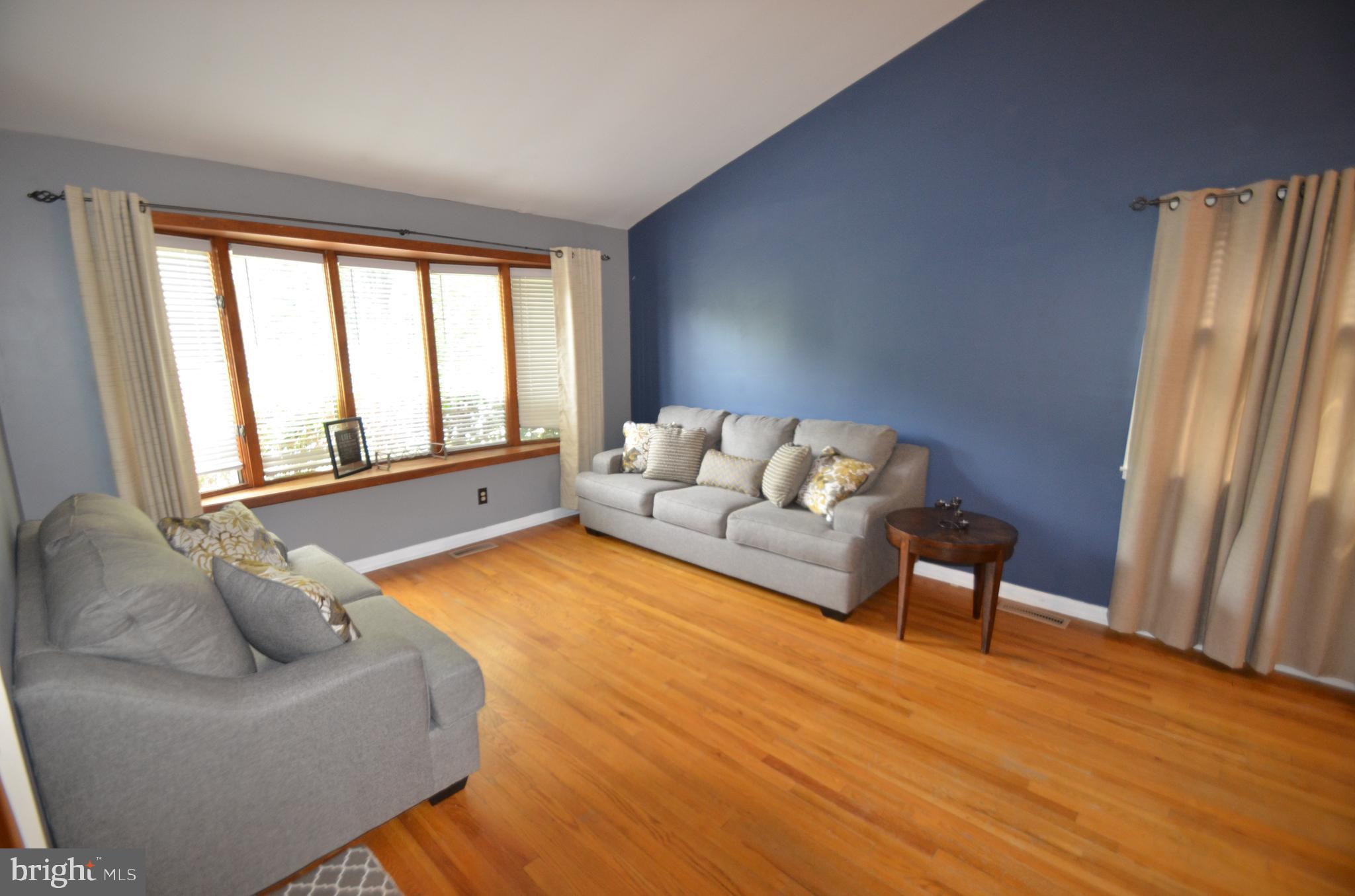 422 Madingley Road Linthicum Heights, MD 21090 - Photo 6 of 36 a living room with furniture and a large window