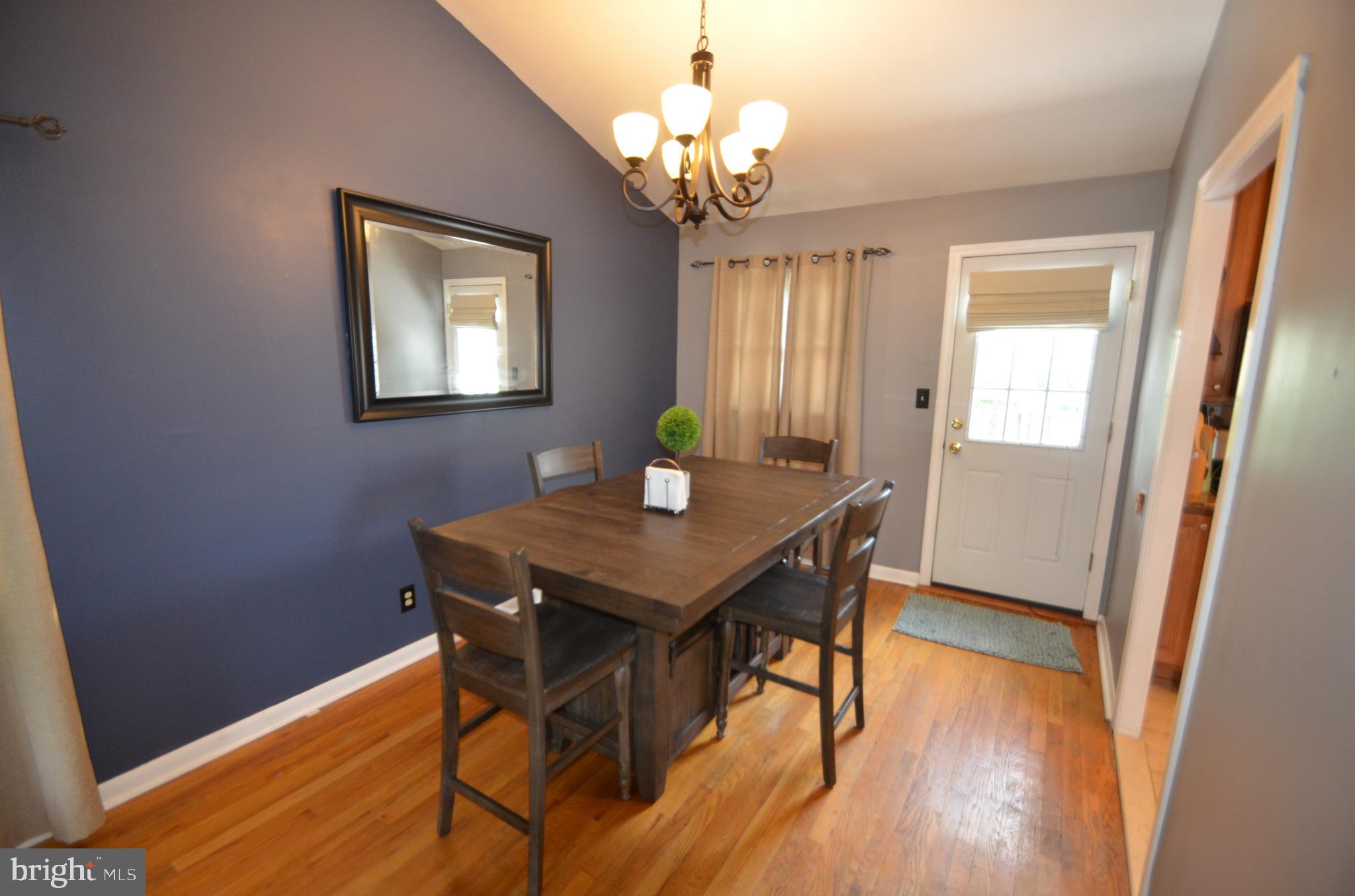 422 Madingley Road Linthicum Heights, MD 21090 - Photo 8 of 36 a view of a dining room with furniture and wooden floor