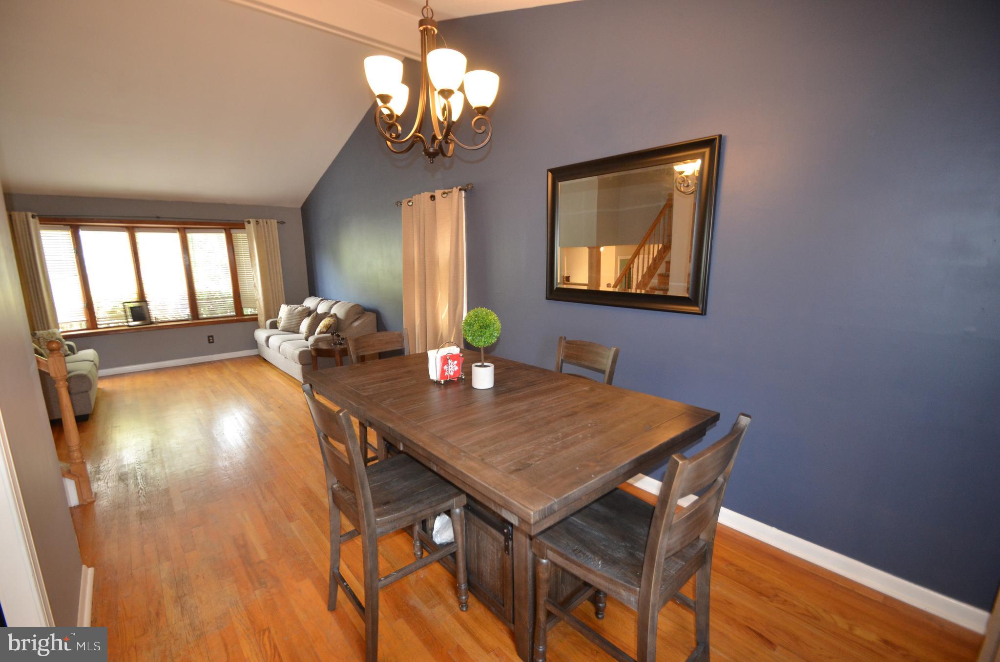 422 Madingley Road Linthicum Heights, MD 21090 - Photo 9 of 36 a view of a dining room with furniture and chandelier