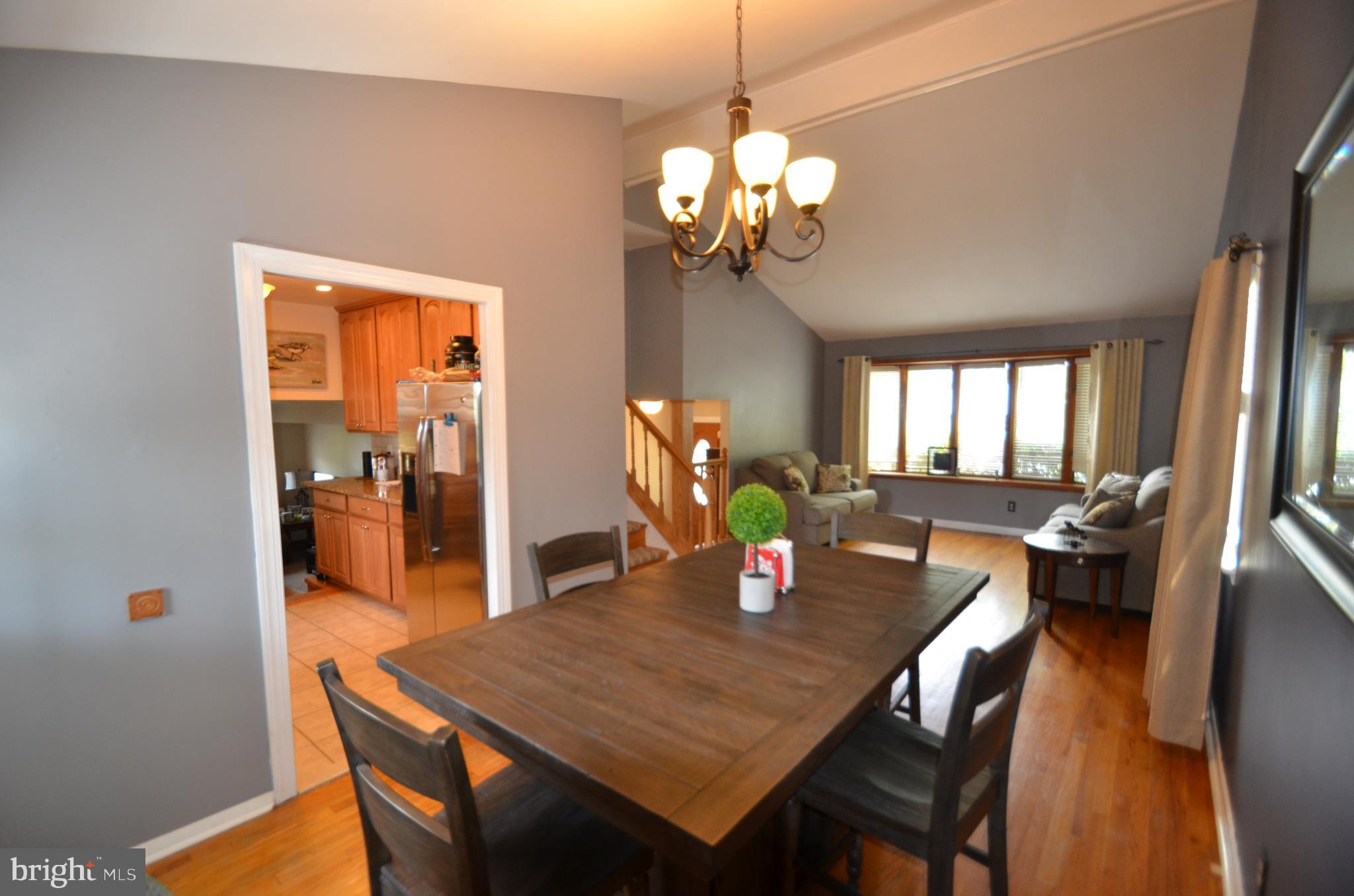 422 Madingley Road Linthicum Heights, MD 21090 - Photo 10 of 36 a view of a dining room with furniture and chandelier