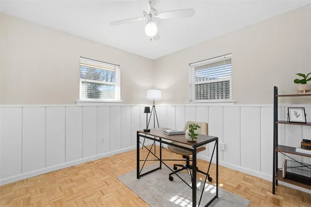 a workspace with furniture and a window