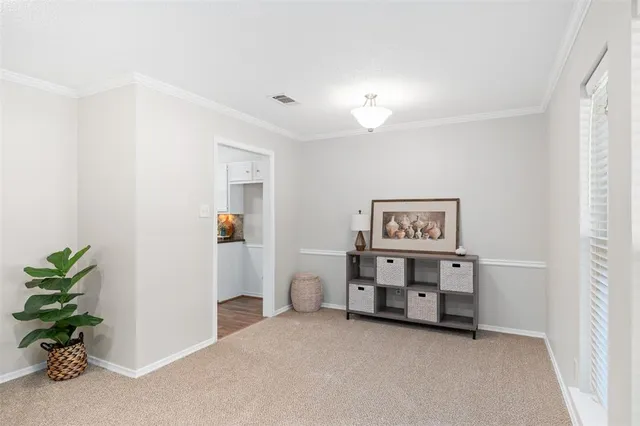 a view of a bedroom with cabinet and a potted plant