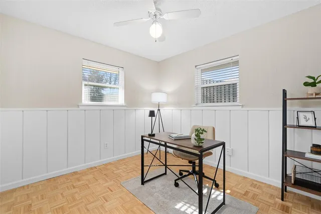 a workspace with furniture and a window