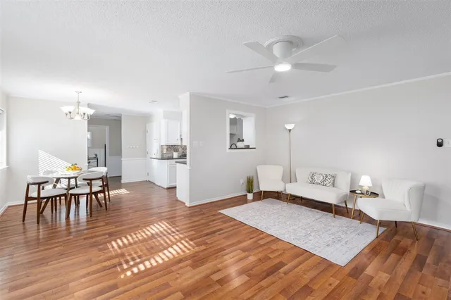 a bedroom with furniture and wooden floor