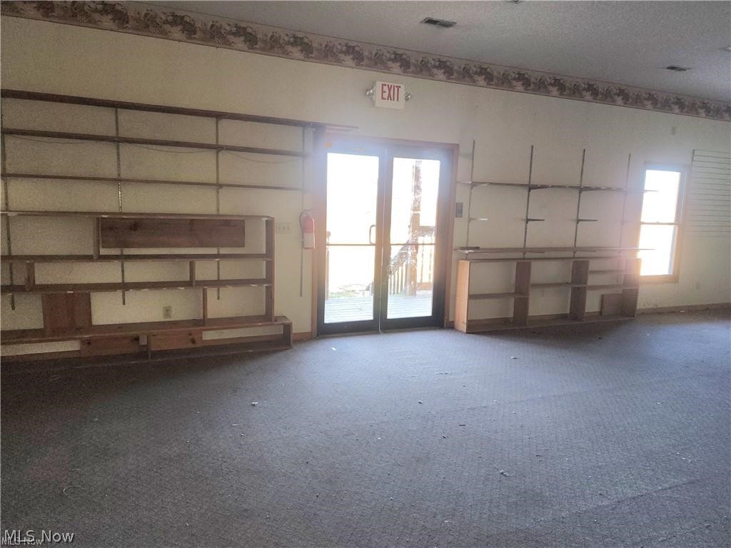 10345 Marne Road Frazeysburg, OH 43822 - Photo 48 of 50 Unfurnished living room with a textured ceiling and carpet floors