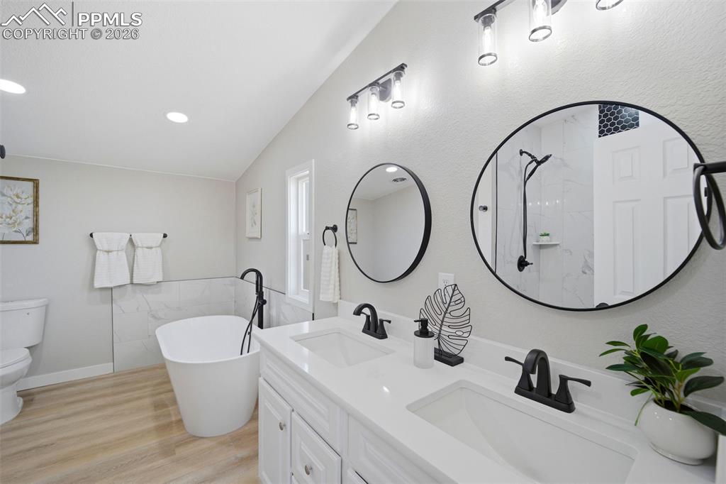 35125 Book Road Yoder, CO 80864 - Photo 14 of 45 a bathroom with a sink and a mirror