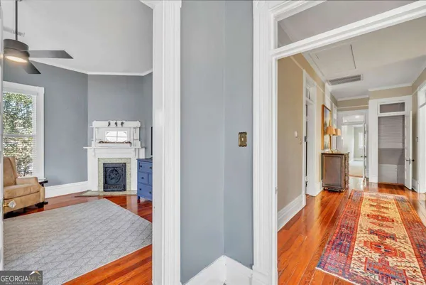 a front view of a house with large garden and outdoor seating