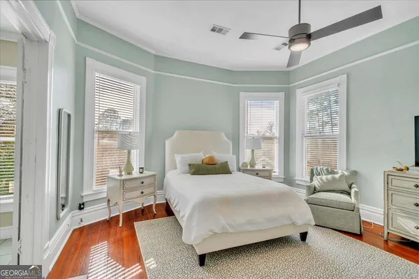 a view of living room filled with furniture and a chandelier