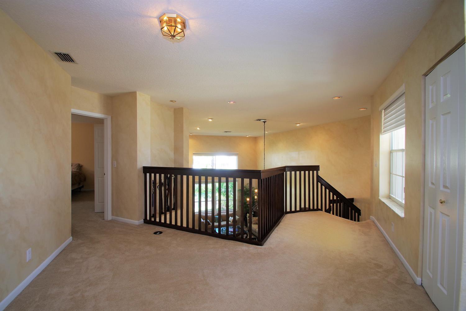 6535 Colomera Drive Boca Raton, FL 33433 - Photo 21 of 36 a view of staircase with railing and a window