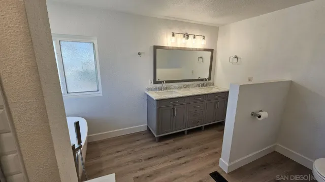 a view of cabinets and wooden floor