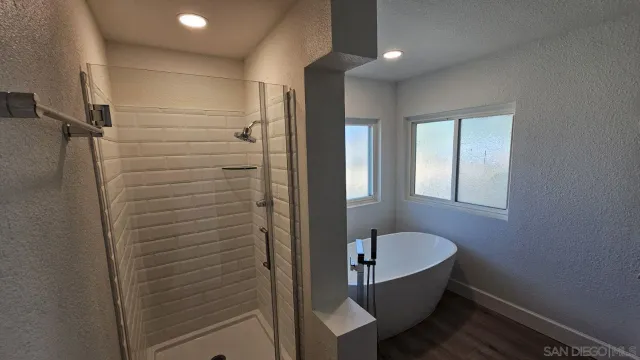 a bathroom with a sink and shower