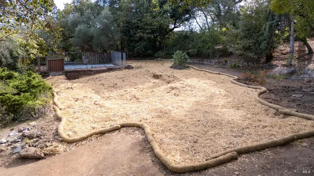 a view of a backyard of the house