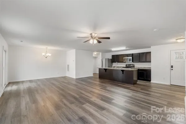 a view of kitchen with cabinets and wooden floor