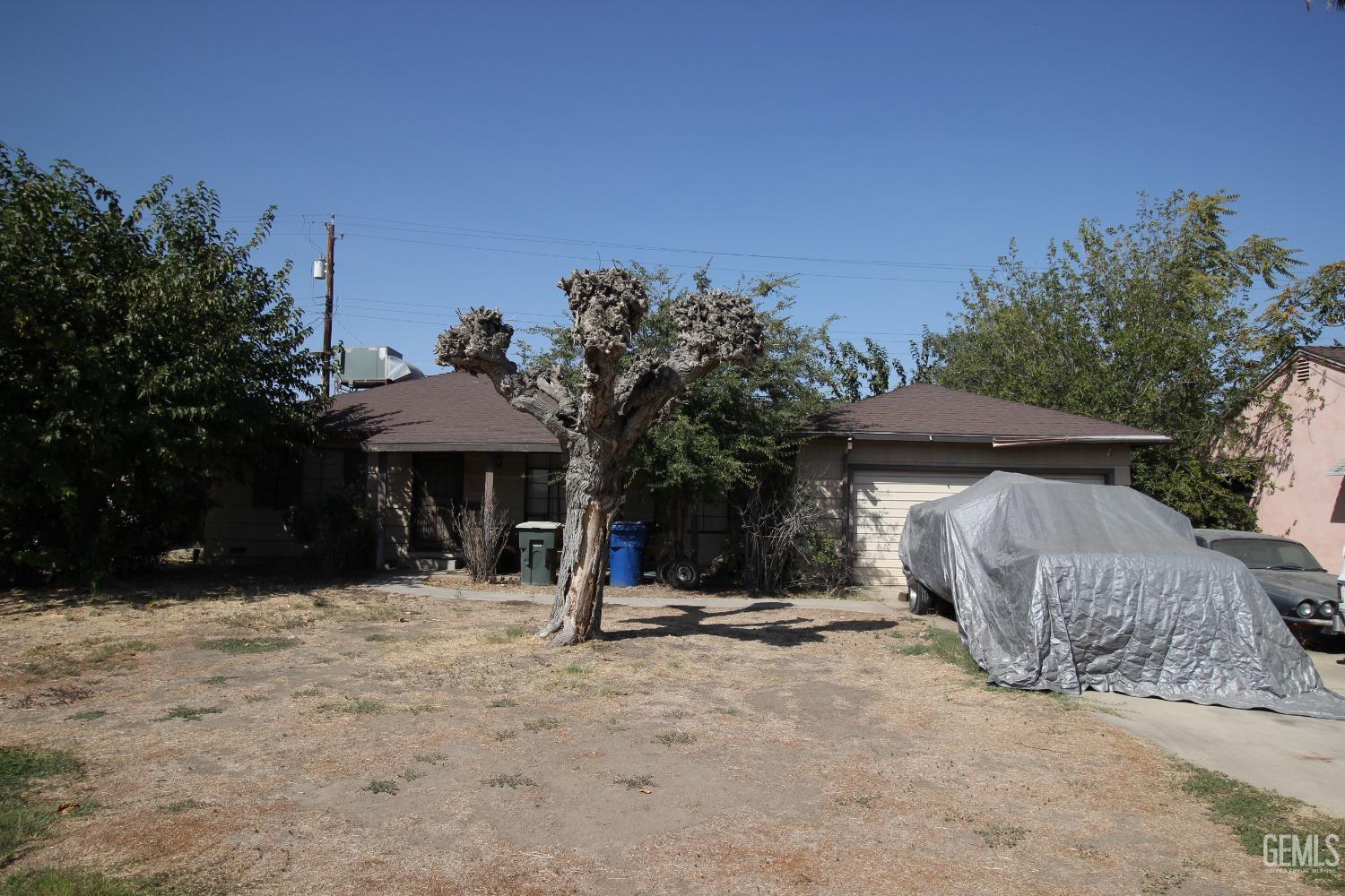 Undisclosed Address Bakersfield, CA 93309 - Photo 2 of 4 a view of a house with a yard