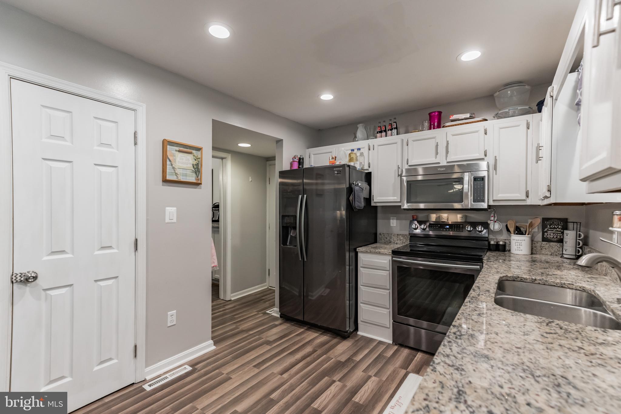 285 Hilltop Road Lusby, MD 20657 - Photo 11 of 28 Kitchen with Granite and Hardwood