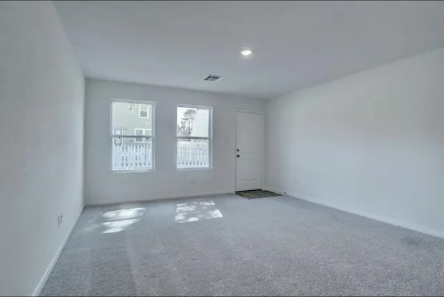 an empty room with windows