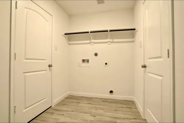 a bathroom with a granite countertop sink a mirror a bathtub and shower