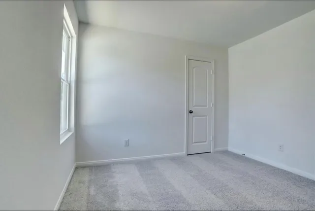 an empty room with windows