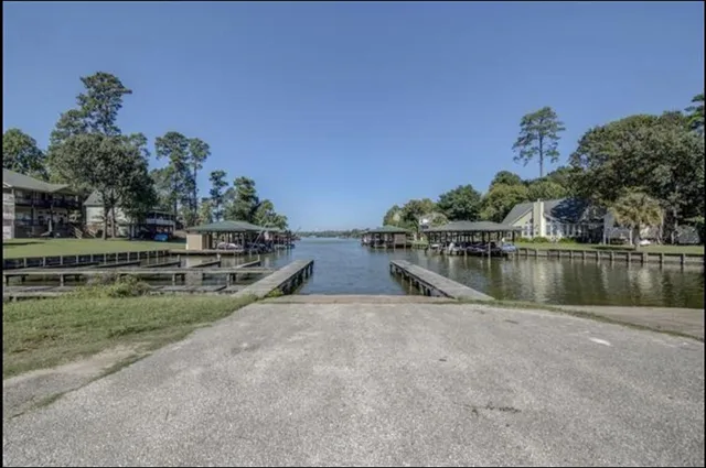a view of a dirt road and a building