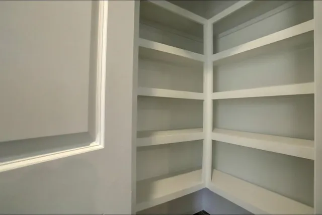 a view of an empty walk in closet