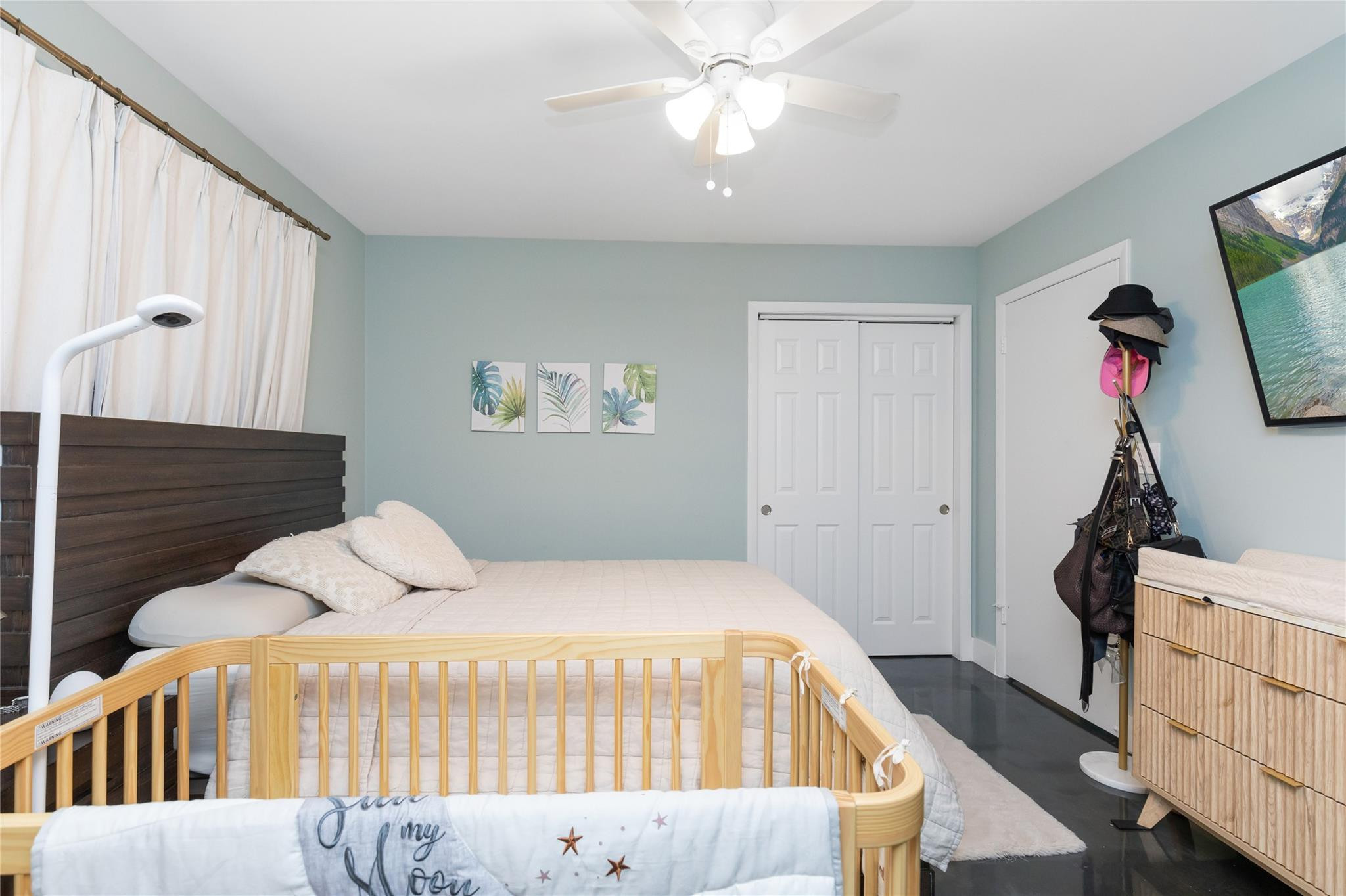 3461 Southwest 24th Street Miami, FL 33145 - Photo 19 of 55 a bedroom with a bed and a flat tv screen on dresser