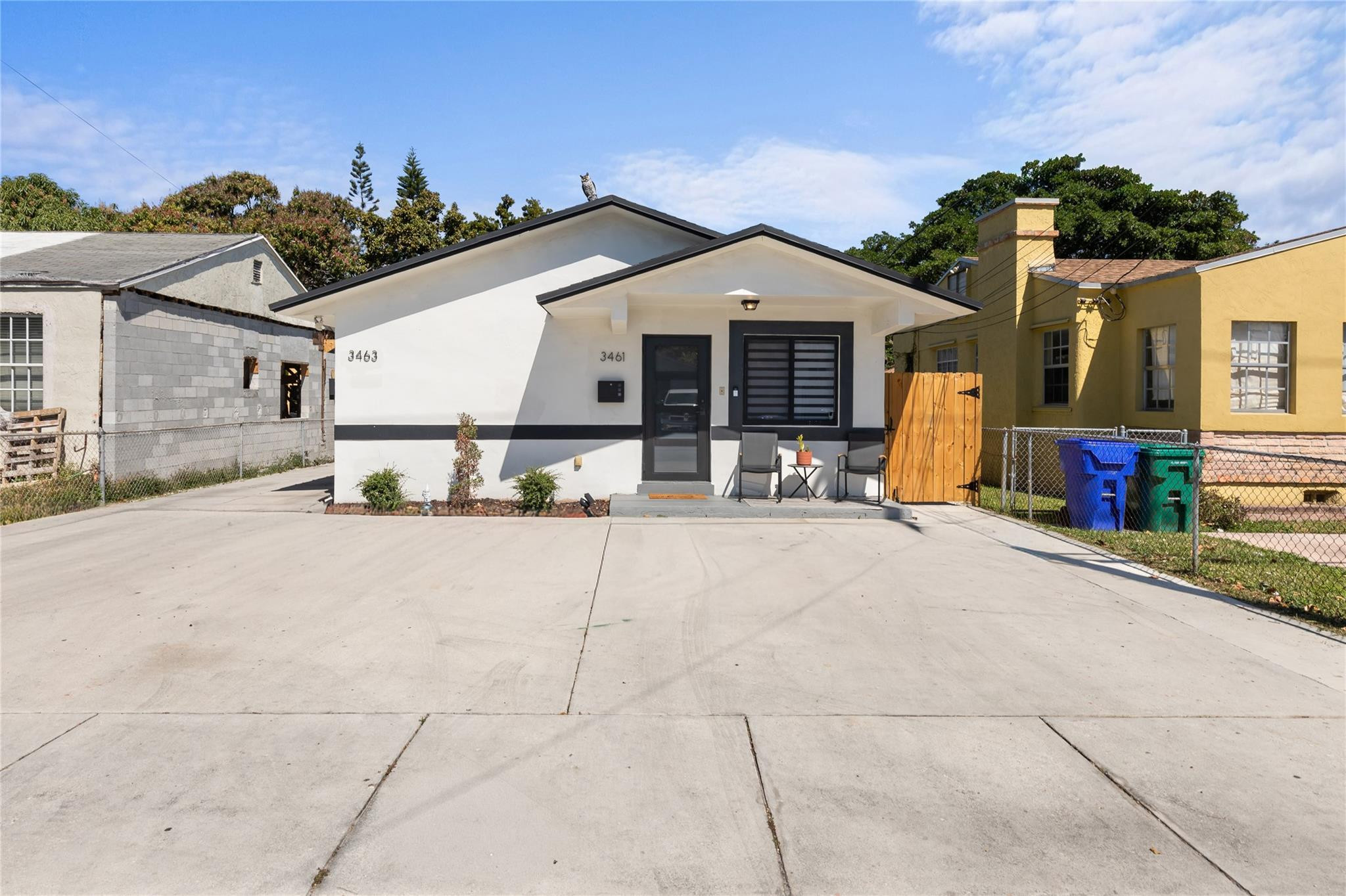 3461 Southwest 24th Street Miami, FL 33145 - Photo 2 of 55 a view of a house with a yard and large parking space