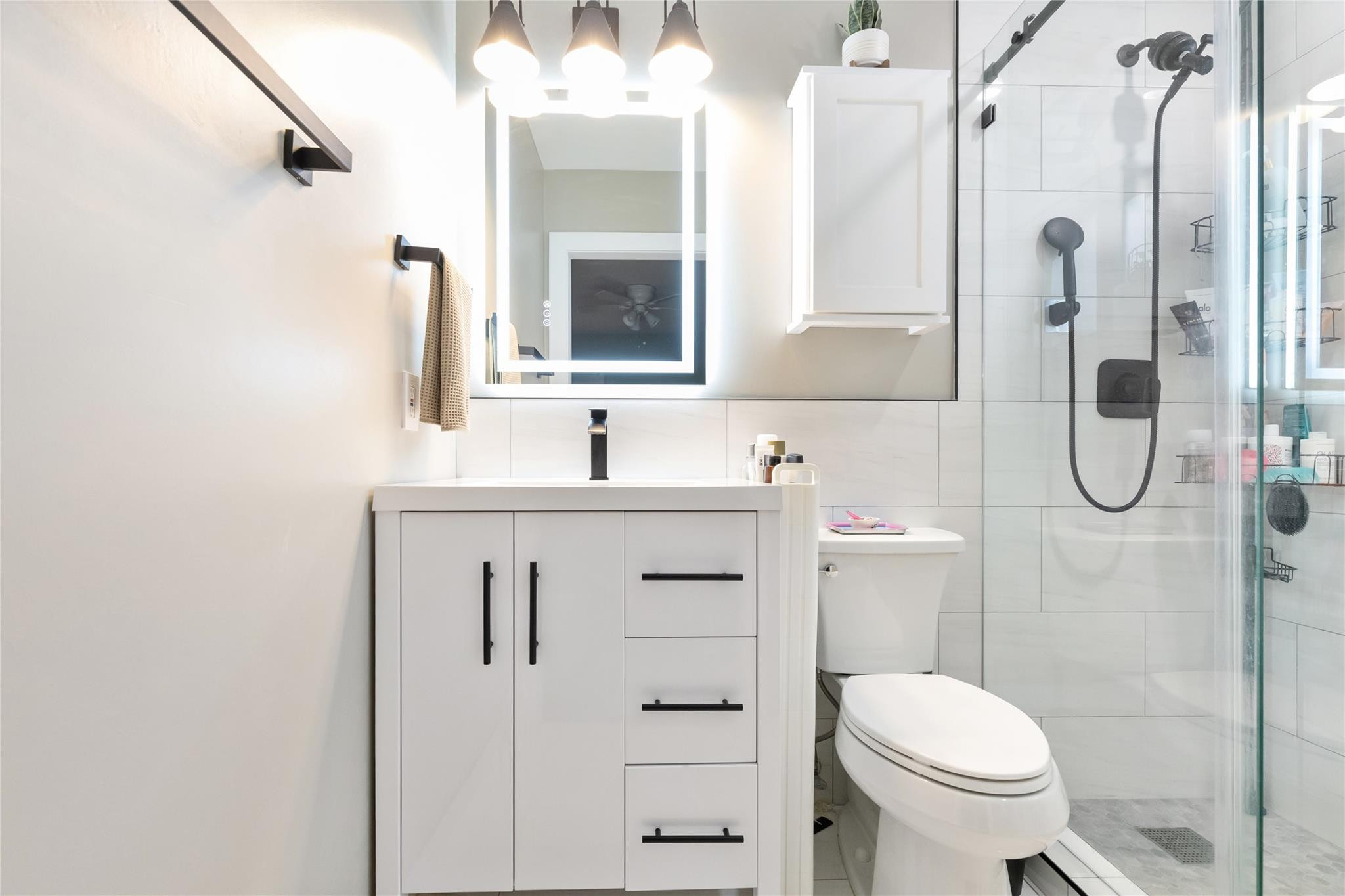 3461 Southwest 24th Street Miami, FL 33145 - Photo 21 of 55 a bathroom with a sink a toilet and shower