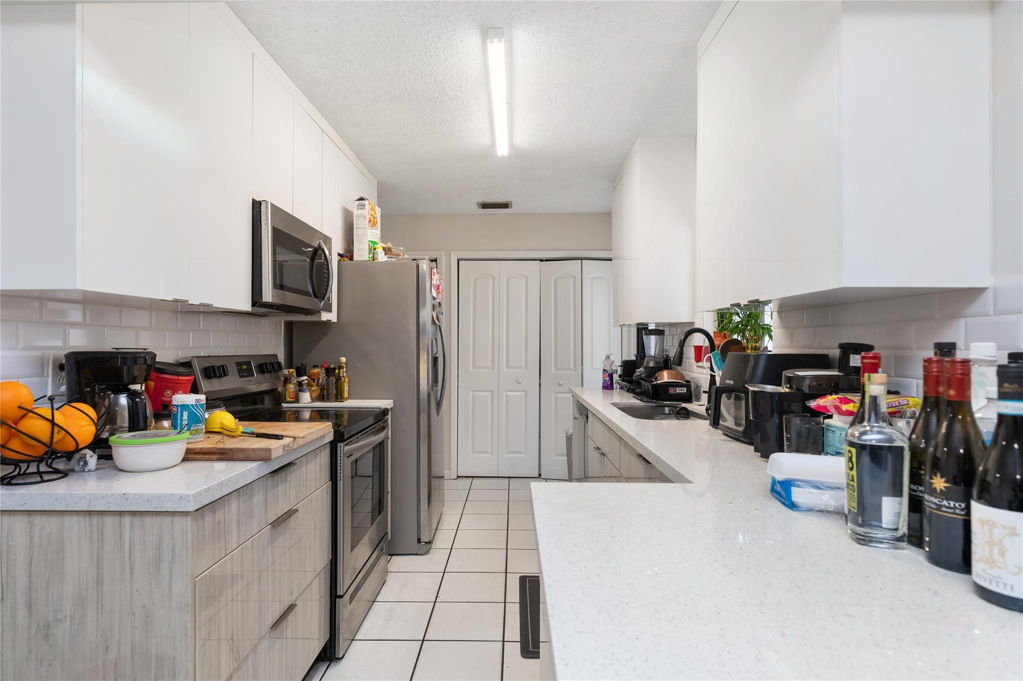 3461 Southwest 24th Street Miami, FL 33145 - Photo 36 of 55 a view of a kitchen with a refrigerator a stove and a sink