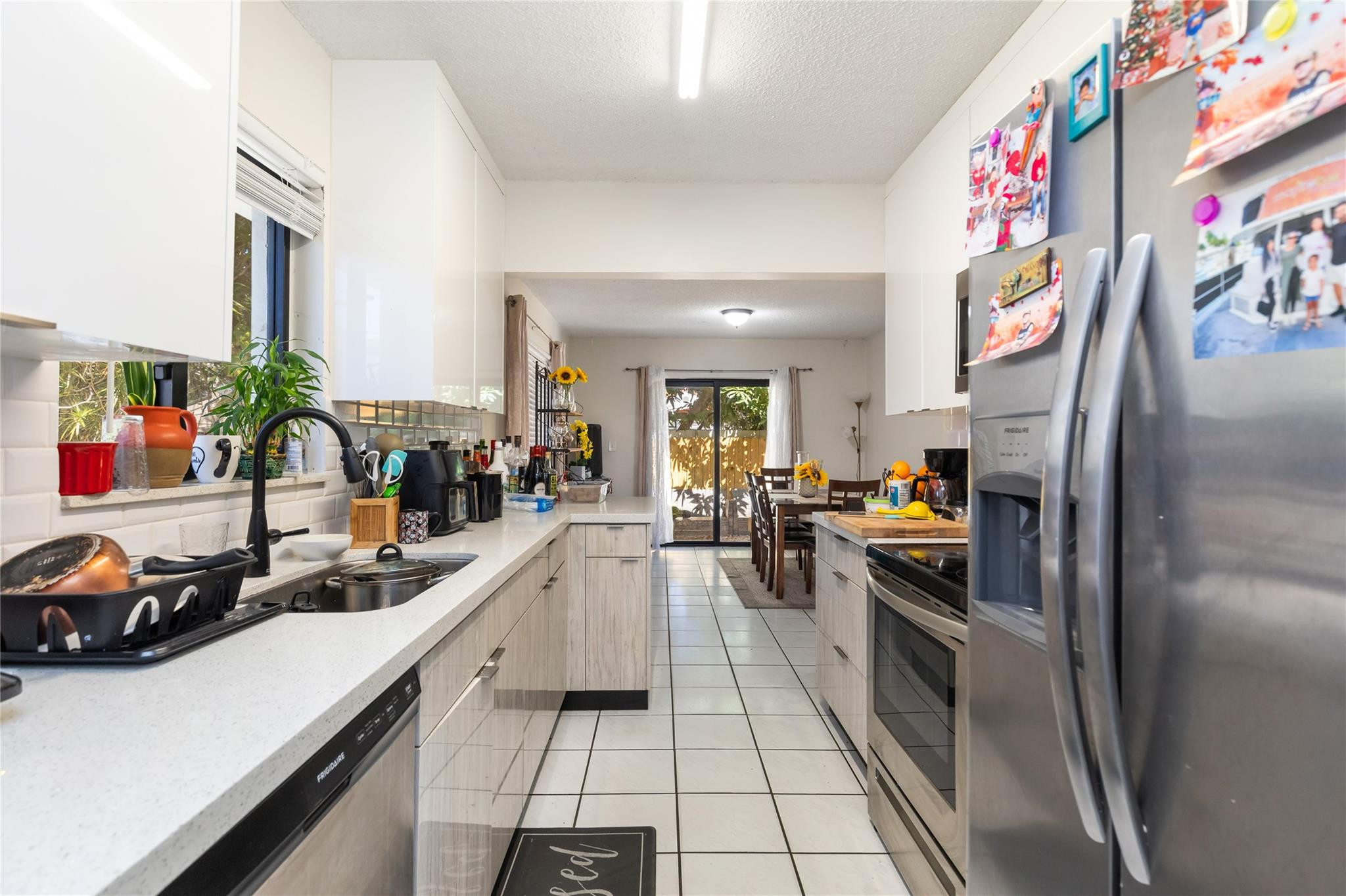 3461 Southwest 24th Street Miami, FL 33145 - Photo 38 of 55 a kitchen with stainless steel appliances a sink a stove and a refrigerator