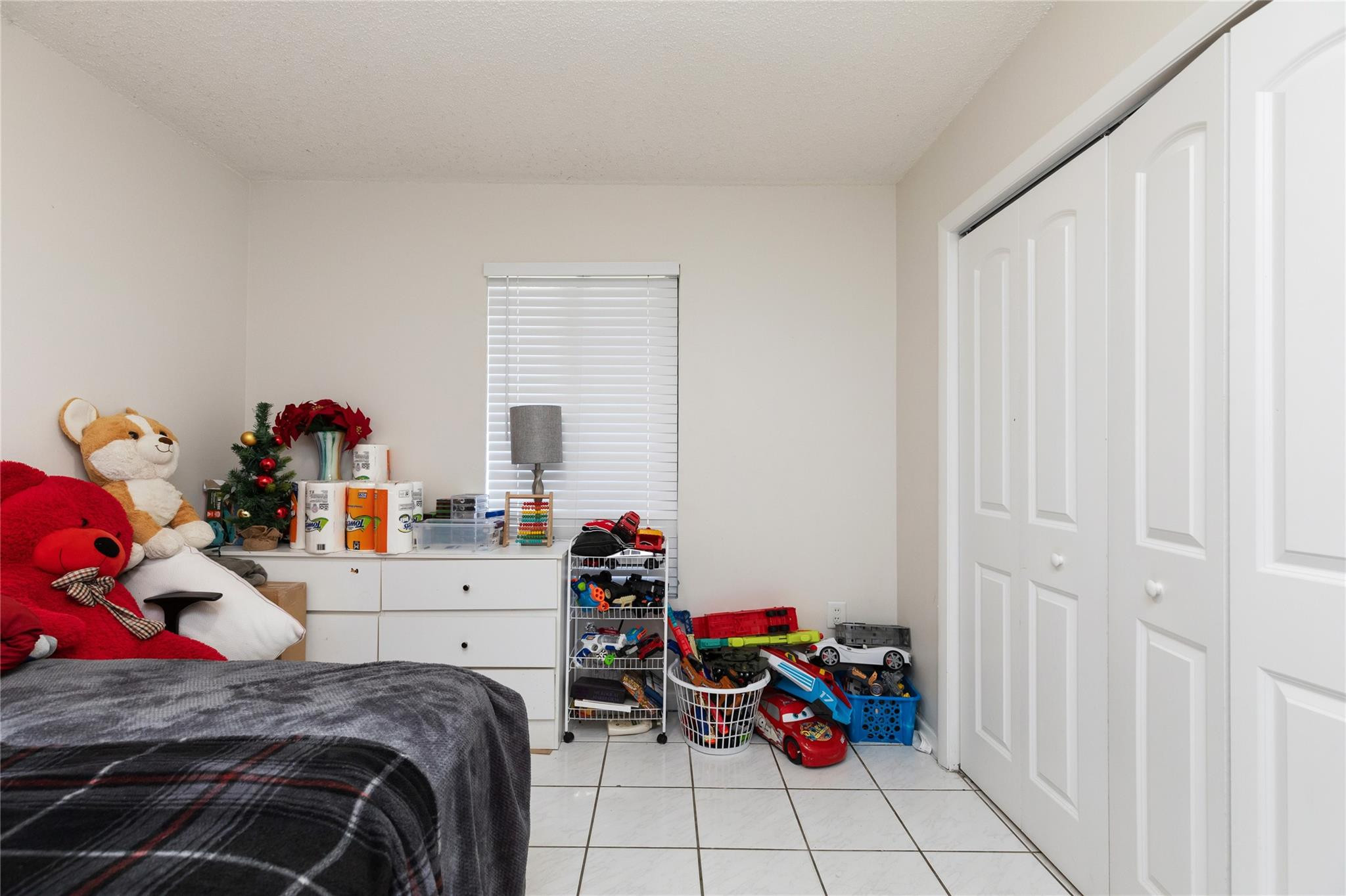 3461 Southwest 24th Street Miami, FL 33145 - Photo 43 of 55 a bedroom with a bed and a window