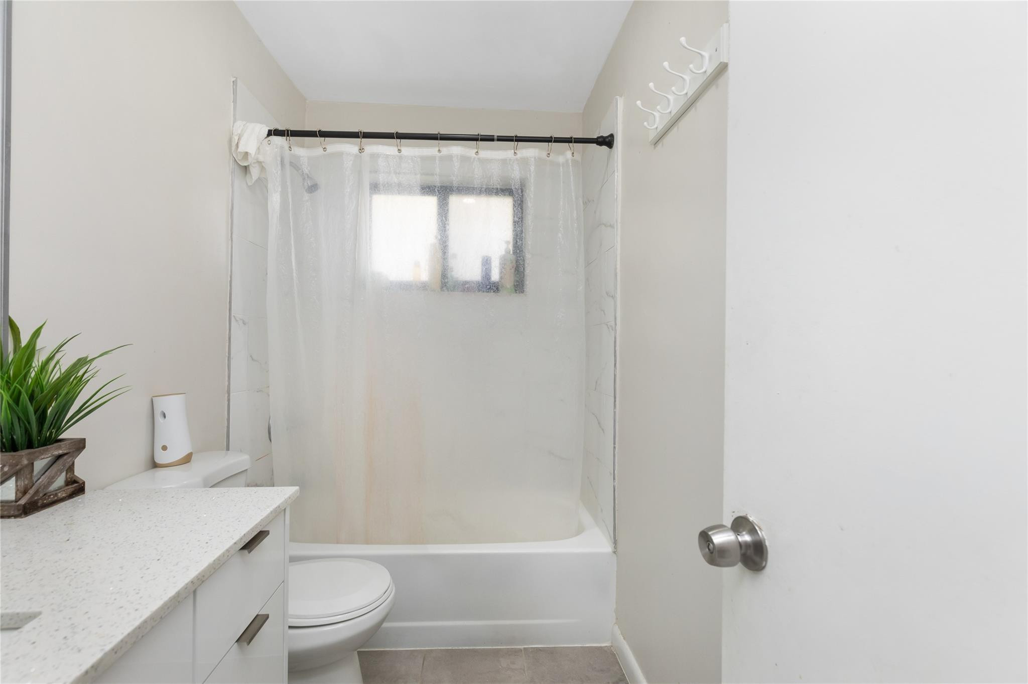 3461 Southwest 24th Street Miami, FL 33145 - Photo 45 of 55 a bathroom with a shower a toilet and a sink