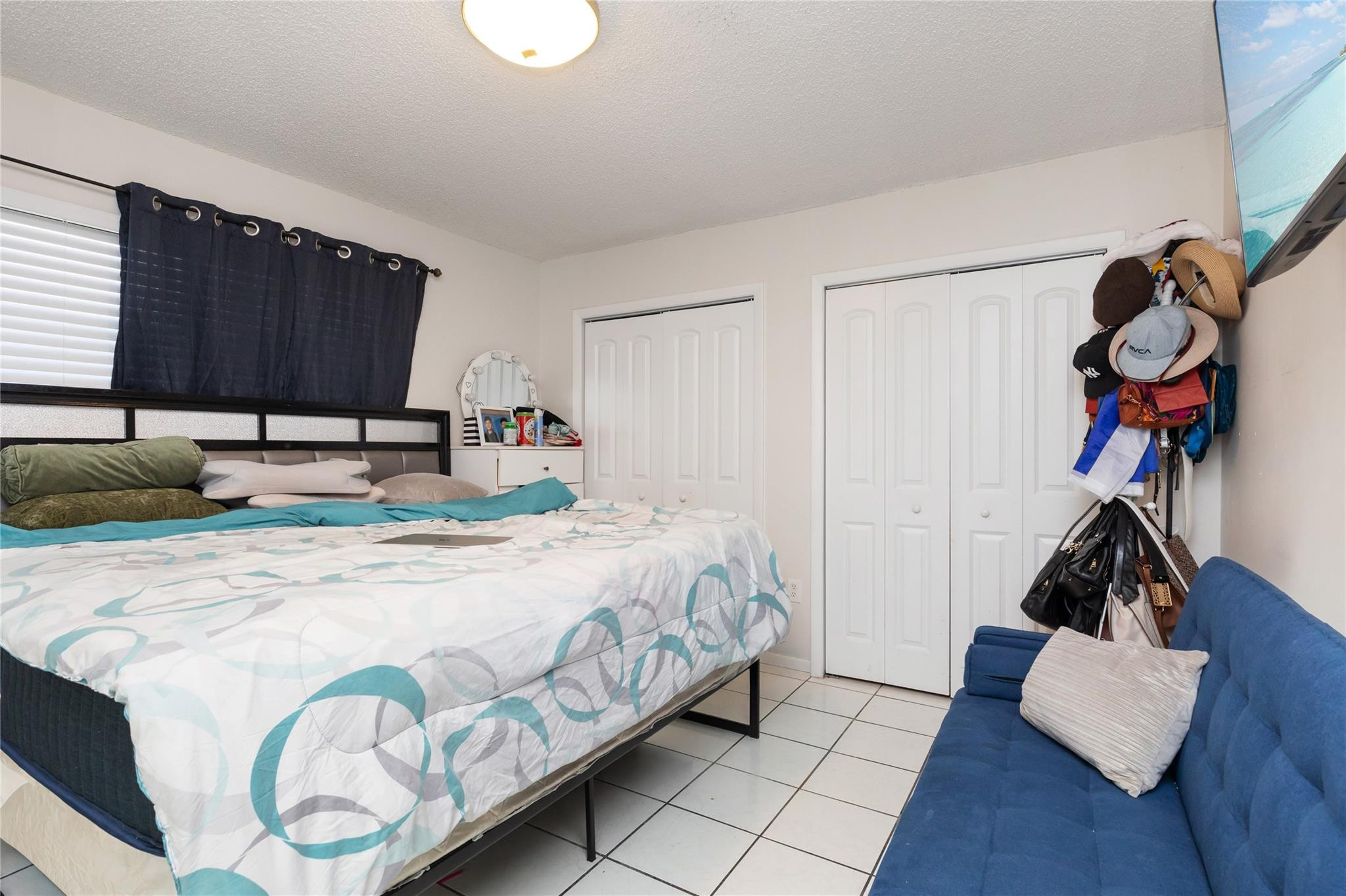 3461 Southwest 24th Street Miami, FL 33145 - Photo 48 of 55 a bedroom with a bed and a closet