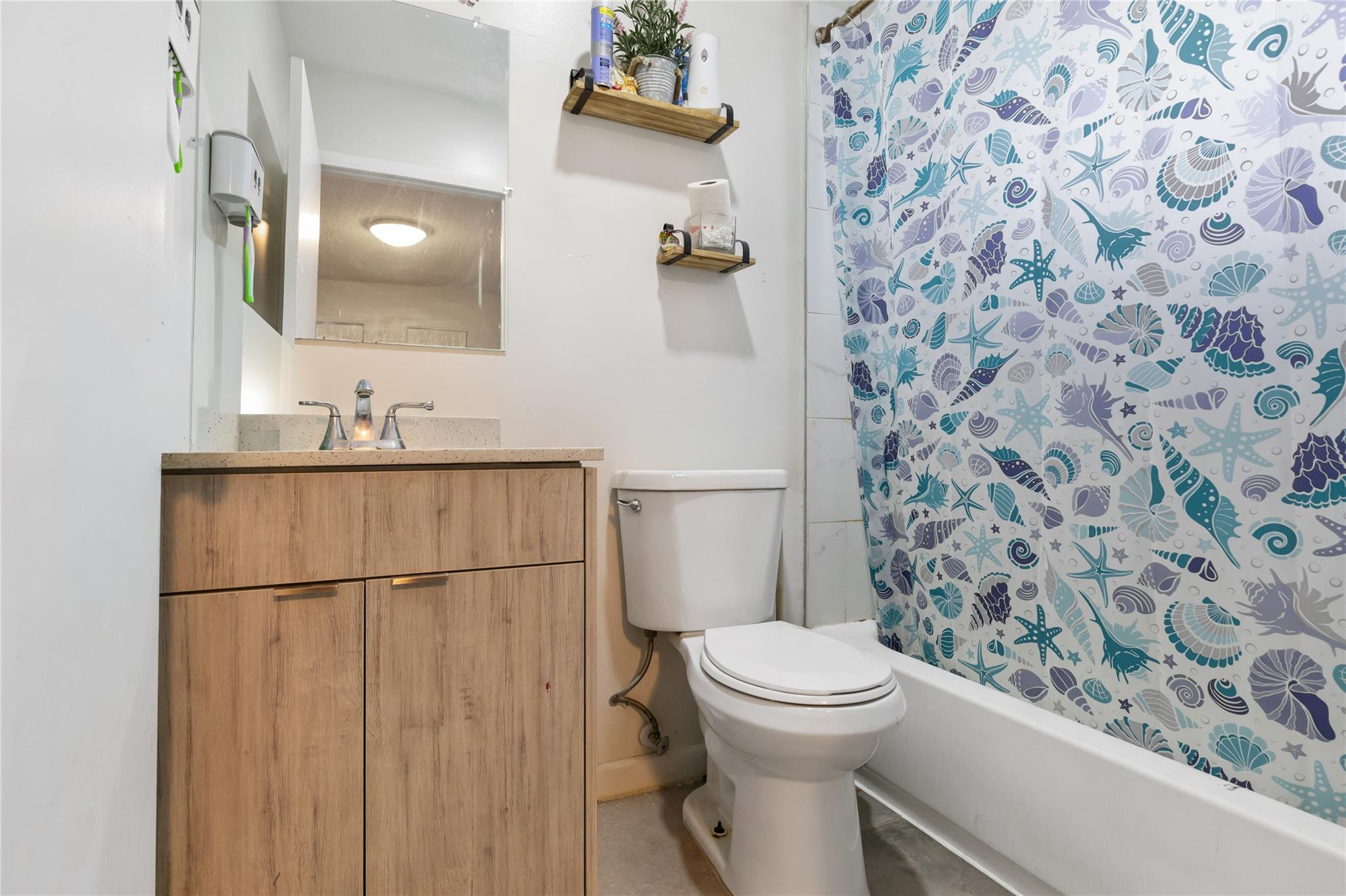 3461 Southwest 24th Street Miami, FL 33145 - Photo 50 of 55 a bathroom with a toilet and a shower curtain