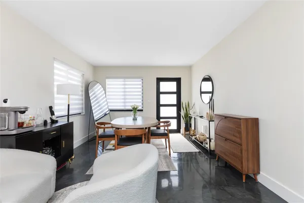 a kitchen with stainless steel appliances a stove a sink and a refrigerator