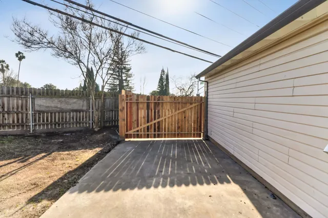 a view of backyard with a deck