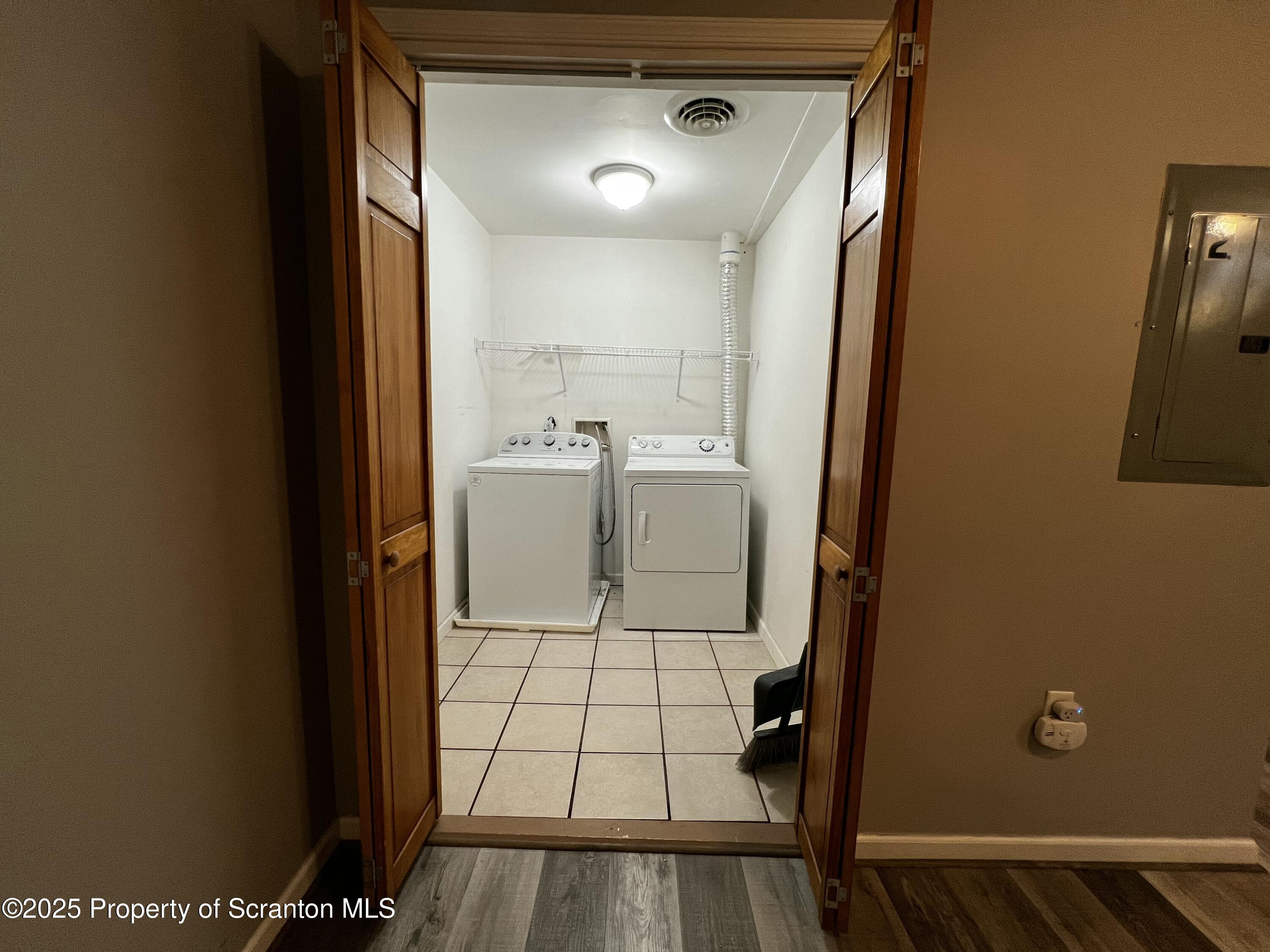205 North Washington Avenue, Unit 2 Scranton, PA 18503 - Photo 3 of 12 a bathroom with a sink toilet and a mirror