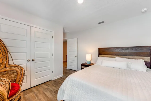 a view of a livingroom with workspace and a window