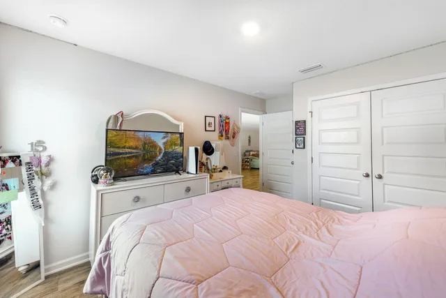 a bedroom with a bed and closet