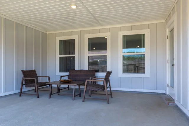 a bathroom with a granite countertop sink toilet a shower and a mirror
