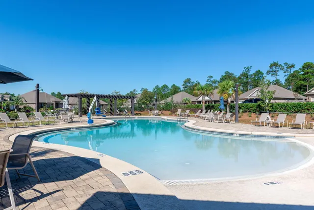 a view of a swimming pool with lounge chair