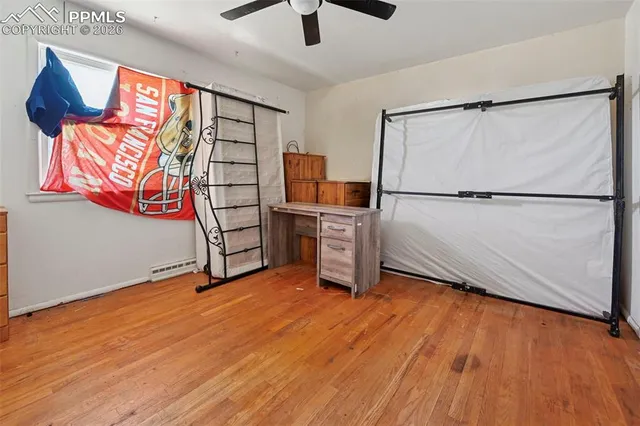 a view of kitchen with stainless steel appliances wooden floor