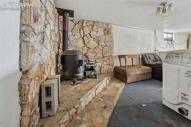 a bedroom with furniture and a fireplace