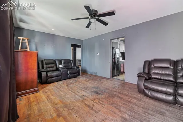 a bed room with furniture and wooden floor
