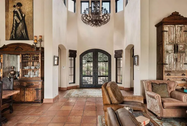 a view of a livingroom with furniture and front door