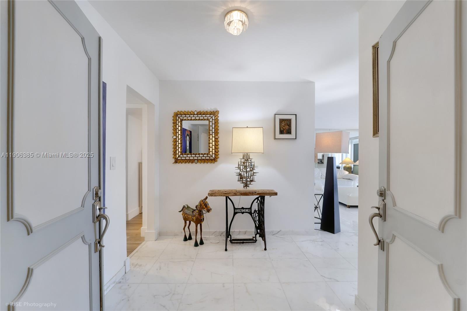 881 Ocean Drive, Unit 5D Key Biscayne, FL 33149 - Photo 1 of 18 a view of a hallway with workspace