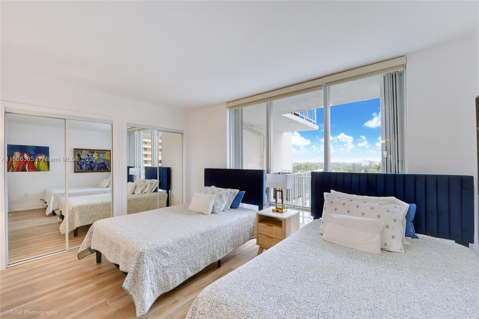 881 Ocean Drive, Unit 5D Key Biscayne, FL 33149 - Photo 13 of 18 a bedroom with a large bed and a large window