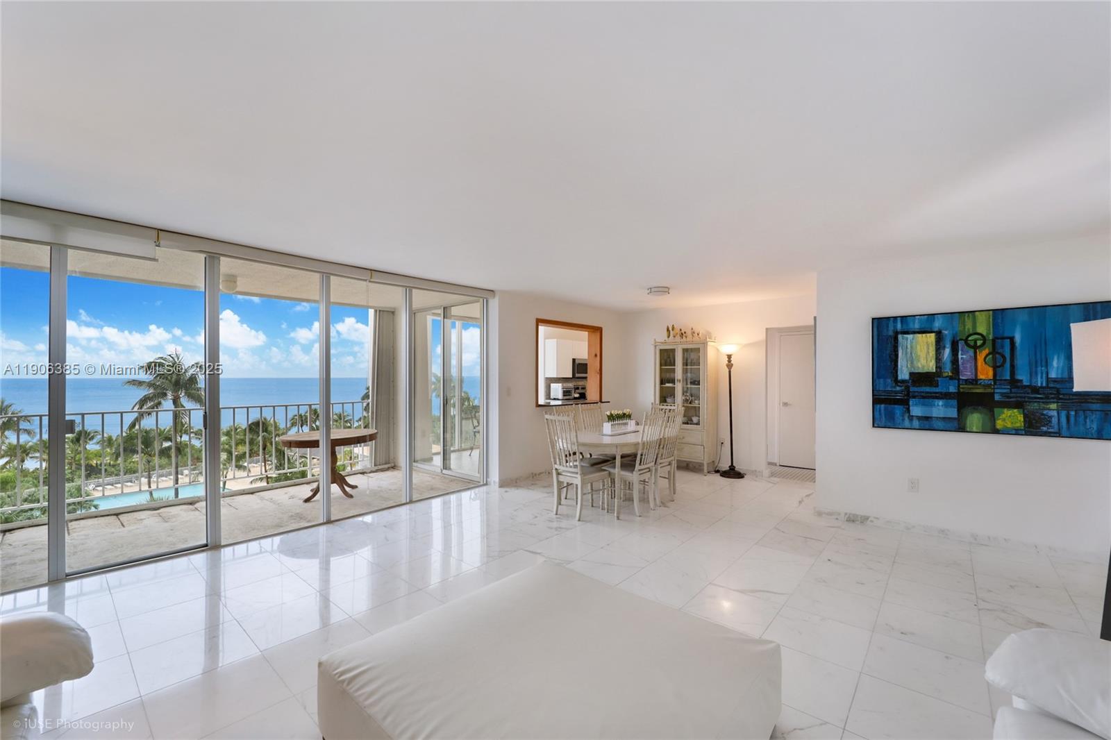 881 Ocean Drive, Unit 5D Key Biscayne, FL 33149 - Photo 2 of 18 a lobby with furniture and floor to ceiling window